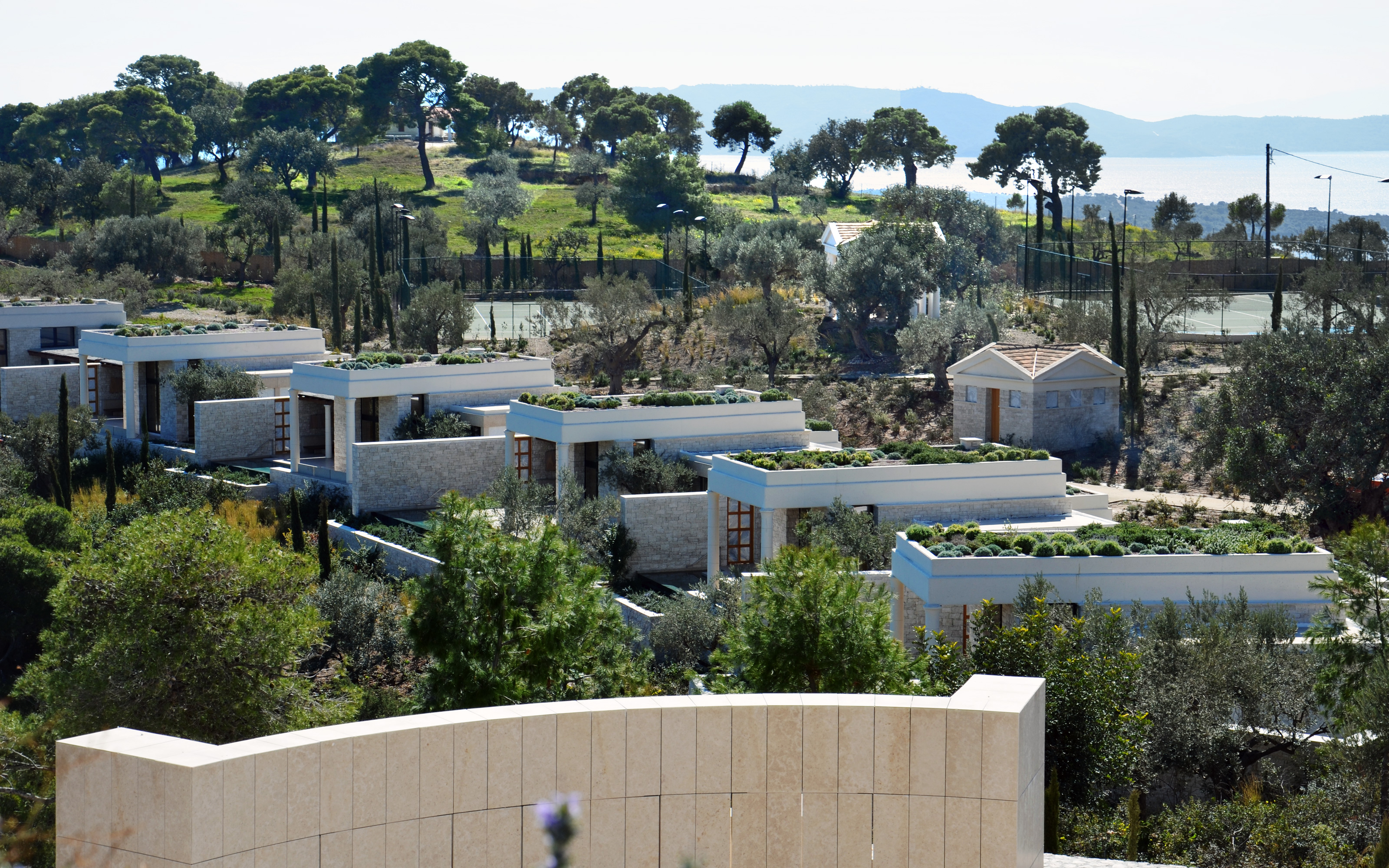 Thanks to its unique hillside the pavilions offer spectacular views. Several stone houses with green roofs in mediterranean landscape